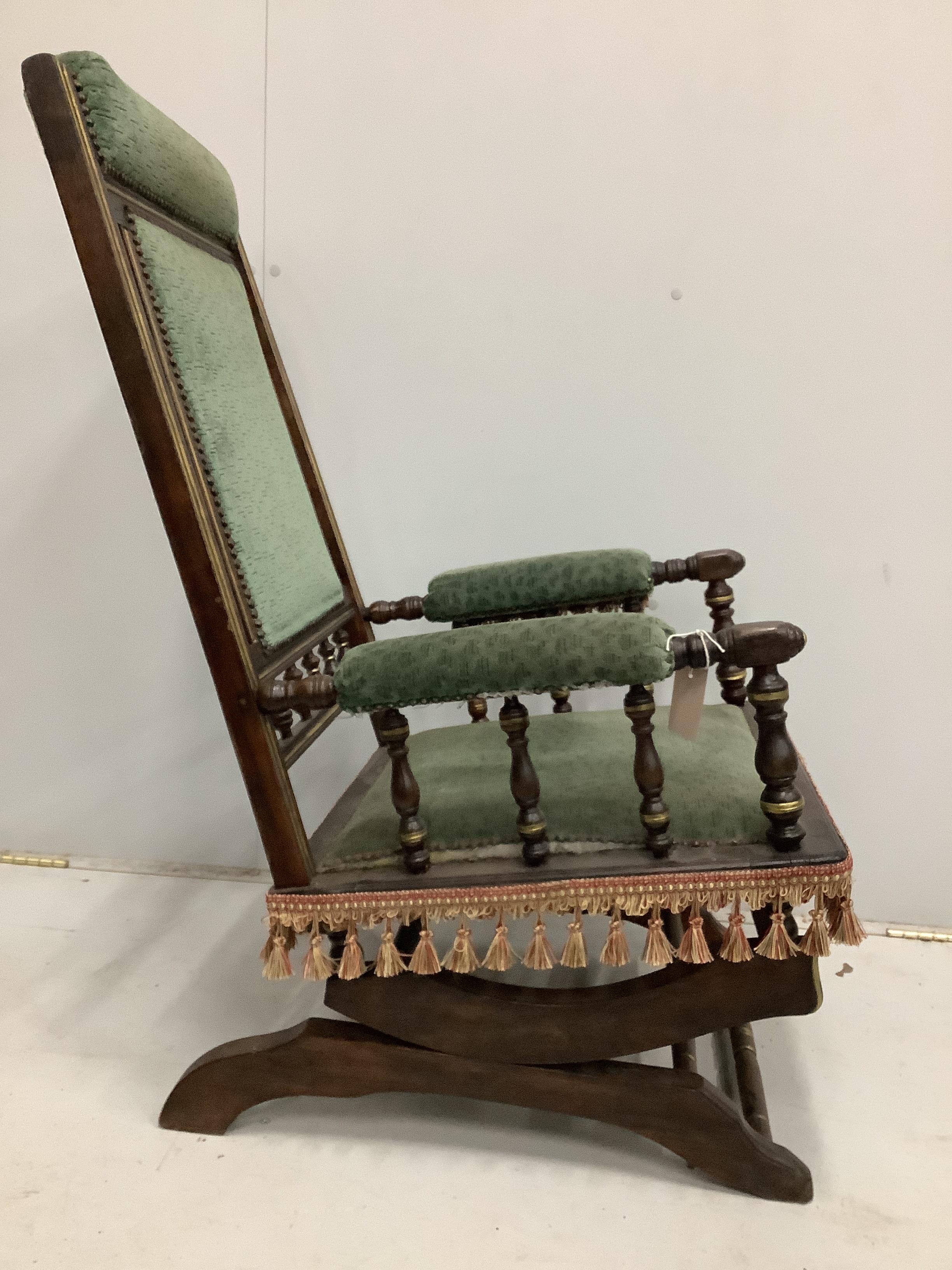 A 19th century American mahogany rocking chair, width 58cm, depth 54cm, height 100cm